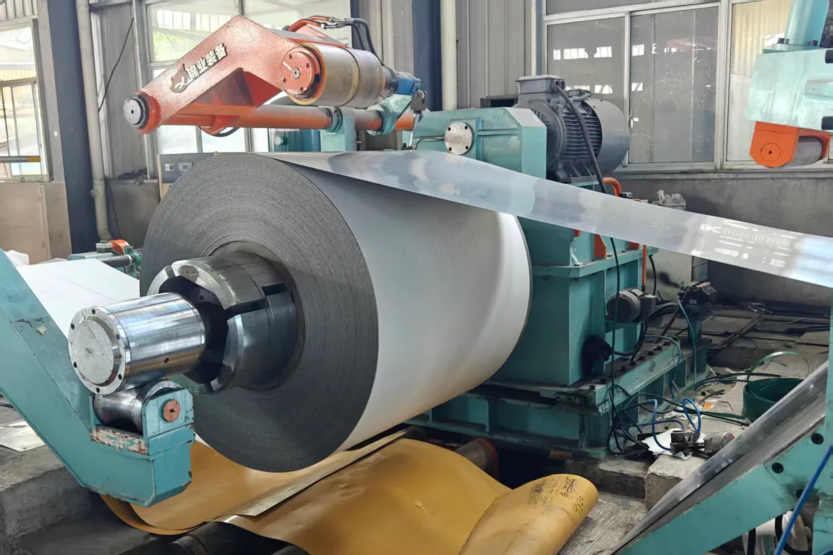 Guarded slitting line producing separated stainless steel strip coils