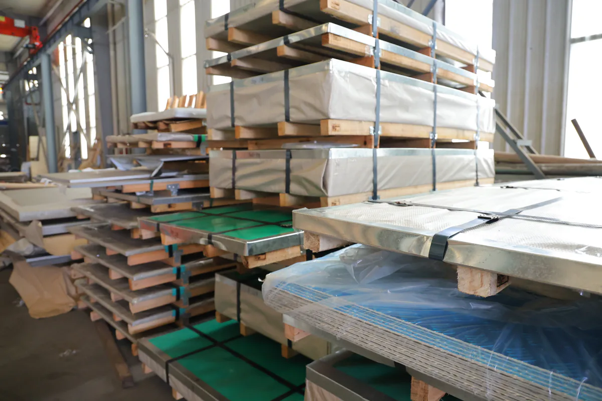 Stainless plate packages supported with timber for handling