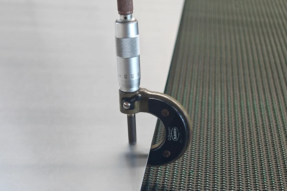 Micrometer checking stainless sheet thickness