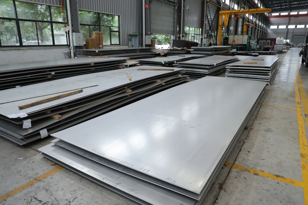 Stainless plate stored in an organized warehouse area